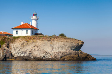 Fototapeta na wymiar White lighthouse with red light on St. Anastasia Island