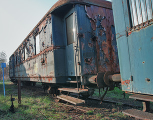 Fototapeta na wymiar Old abandoned trains at depot in sunny day