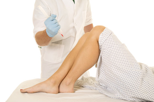 Woman patient legs doctor needle ready to stick