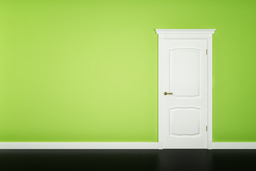 Closed white door on green wall