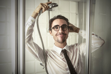 Cheerful businessman in the shower