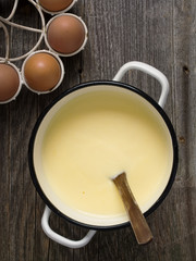 pot of creamy custard sauce