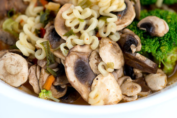 Macro of Japanese ramen noodles with vegetables and broth