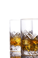 Whisky in a glass with ice cubes