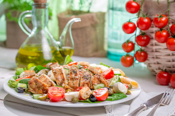 Homemade caesar salad with fresh vegetables