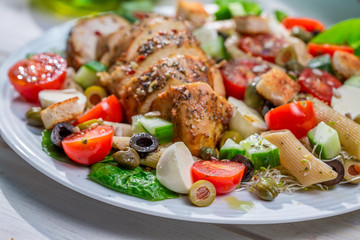 Closeup of homemade caesar salad with fresh vegetables