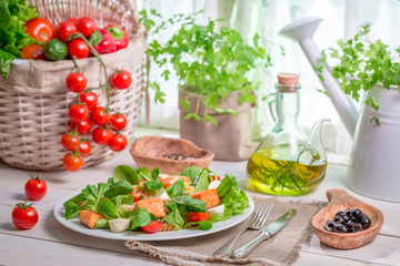 Homemade salad with salmon and vegetables