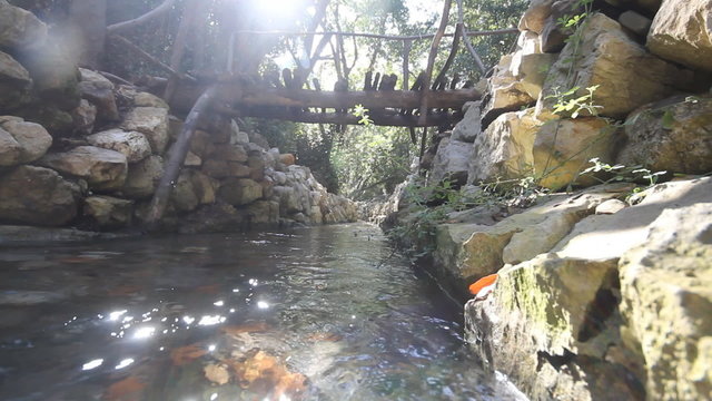 city ruins Olimpos bridge through a stream
