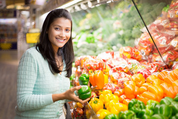 Closeup portrait, woman grocery shopping veggies