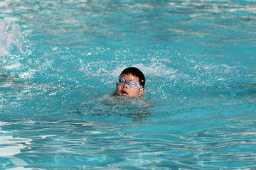 Asian boy in the swimming pool..