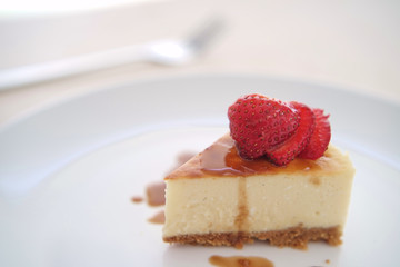 Small slice of cheesecake on a big plate