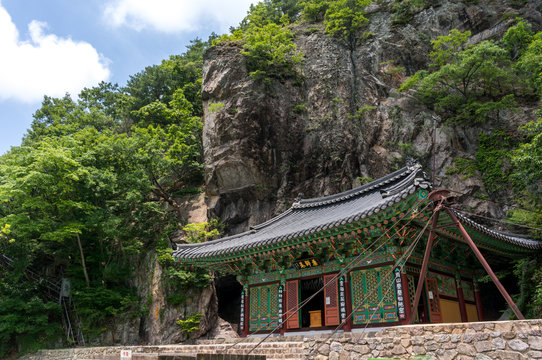 A small temple under a cliff. Taken in Baegyangsa, South Korea.