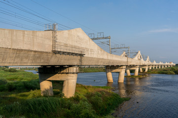 Korean railway bridge over a river.