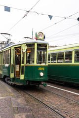Fototapeta na wymiar The green historic tram in Turin