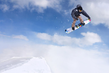 Naklejka na ściany i meble Jumping snowboarder