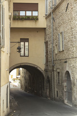 Fototapeta na wymiar Stone arches on a street from Tuscany
