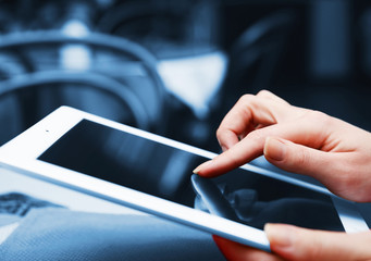 Woman with tablet computer in cafe shop