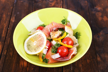 Fresh fish salad with vegetables