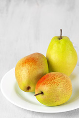 Pears on white wood