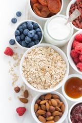 cereal and various delicious ingredients for breakfast, vertical