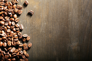 Coffee beans on wooden background