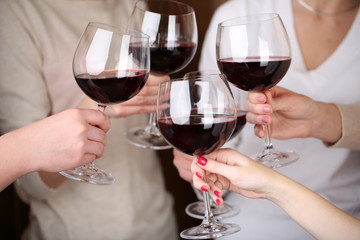 Woman hands with glasses of wine close-up