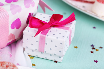 Cute gift on birthday table close-up