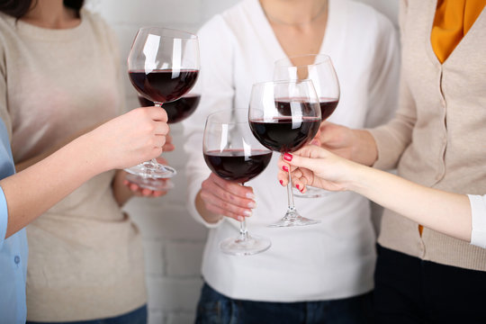 Woman hands with glasses of wine close-up