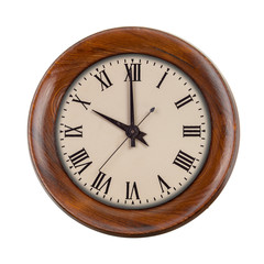 Vintage clockface showing ten o'clock in wooden frame