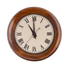 Vintage clockface showing eleven o'clock in wooden frame