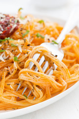 pasta with tomato sauce and parmesan cheese, close-up, vertical
