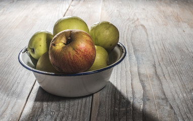 Apples in vintage metal cup