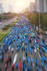 marathon runner legs running on street
