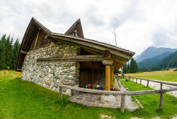 Fototapeta na wymiar Small mountain church on Dolomites, Italy