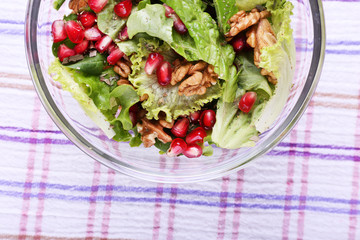 Fresh salad with greens, garnet and spices