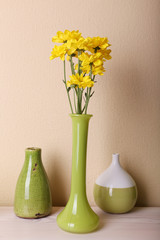 Fireplace with beautiful green decorations in room