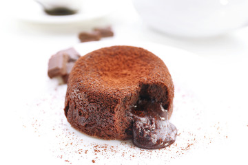 Hot chocolate pudding with fondant centre on plate, close-up