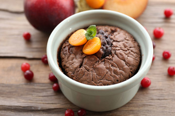 Hot chocolate pudding with fondant centre on table, close-up
