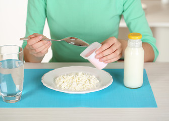 Girl and dietary food at table close-up