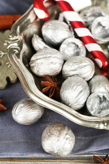 Beautiful Christmas composition with silver walnuts,