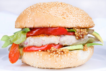 Burger with turkey, avocado, onions, red paprika pepper