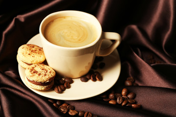 Gentle colorful macaroons and black coffee in mug