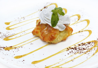 Delicious eclair cake with cream topping and honey syrup