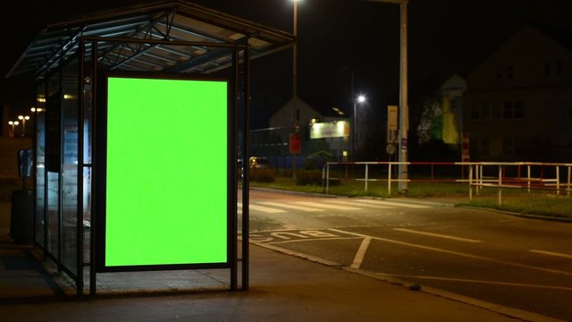 bus stop - billboard - green screen - night - urban street