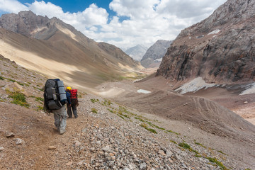 Fototapeta premium Hikers in high mountains.