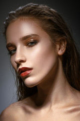 Hot young woman model with sexy bright red lips makeup, strong e