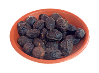 Saw palmetto berries in a small dish