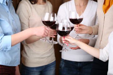 Woman hands with glasses of wine close-up