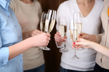 Woman hands with glasses of champagne