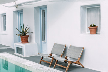 Two chairs near the pool in Santorini, Greece.